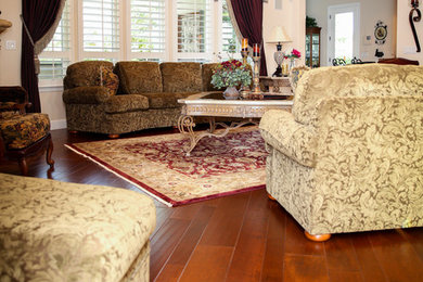 Inspiration for a large timeless formal and enclosed brown floor and dark wood floor living room remodel in Other with white walls, no fireplace and no tv
