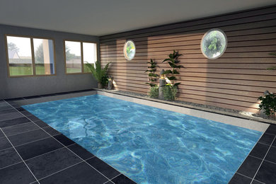 Aménagement d'une piscine bord de mer de taille moyenne et rectangle.