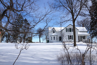 Cottage white two-story wood exterior home idea in Toronto