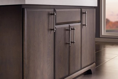 Example of a mid-sized trendy ceramic tile bathroom design in New York with a drop-in sink, flat-panel cabinets, brown cabinets and gray walls
