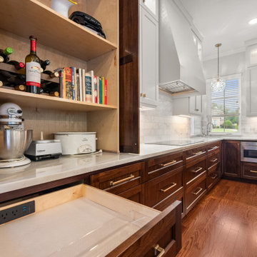 Detailed view of custom appliance and wine storage pantry with charging drawer