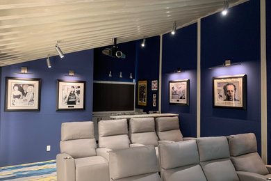 Inspiration for a midcentury enclosed home theatre in Miami.
