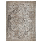 Jaipur Living - Vibe Ginevra Medallion Gray and Ivory Area Rug, 7'10"x10'10" - The stunning En Blanc collection captures the elegance of neutral, vintage-inspired patterns and melds Old World aesthetics with an updated and luxurious vibe. The Ginevra rug boasts a subtly distressed center medallion motif in tonal hues of silver, cool gray, golden tan, and light taupe. Soft and lustrous, this chameleon-like design emulates the timeless style of a Turkish hand-knotted rug, but in an accessible polyester and viscose power-loomed quality.