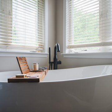 Bathroom Remodel in Sterling, VA Tub, glass shower, double vanity, stone wall