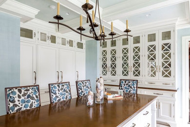 Kitchen - traditional kitchen idea in New York with recessed-panel cabinets, white cabinets, quartz countertops and an island