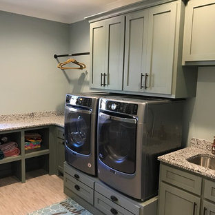 Design ideas for a medium sized traditional separated utility room in Raleigh with shaker cabinets, grey cabinets, granite worktops, grey walls, vinyl flooring, a side by side washer and dryer and beige floors.
