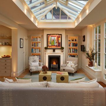 Open plan orangery extension with fireplace (and bespoke dog windows)