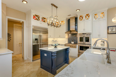 Eat-in kitchen - large transitional u-shaped porcelain tile and beige floor eat-in kitchen idea in Houston with a farmhouse sink, recessed-panel cabinets, white cabinets, quartzite countertops, white backsplash, subway tile backsplash, stainless steel appliances, two islands and white countertops
