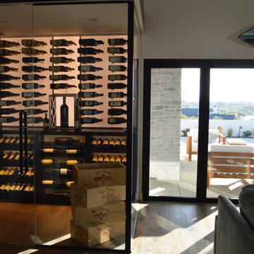 Well-Insulated Glass Wine Room Idea Los Angeles