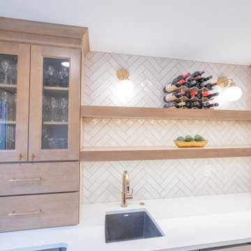Warm & Inviting Basement Retreat with Custom Bar + Entertainment Center
