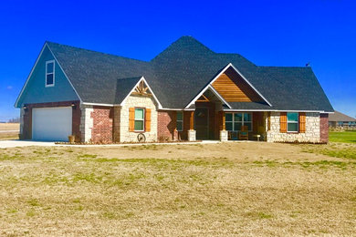Inspiration for a rustic two-story house exterior remodel in Other