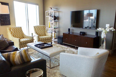 Living room - large transitional open concept medium tone wood floor and brown floor living room idea in Dallas with beige walls and a wall-mounted tv
