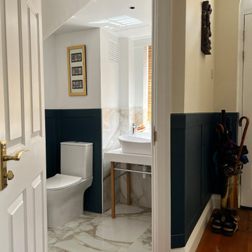 Marble and Blue cloakroom with panelling