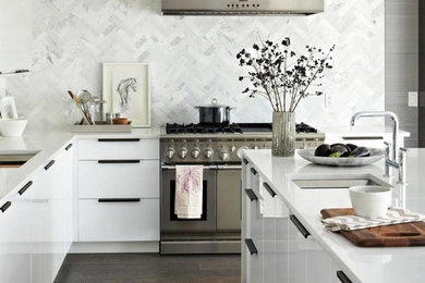 Kitchen - contemporary l-shaped dark wood floor kitchen idea in Montreal with an undermount sink, flat-panel cabinets, white cabinets, quartzite countertops, white backsplash, marble backsplash, stainless steel appliances and an island