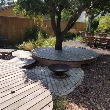 Circular decks around barbeque area - Thames Ditton