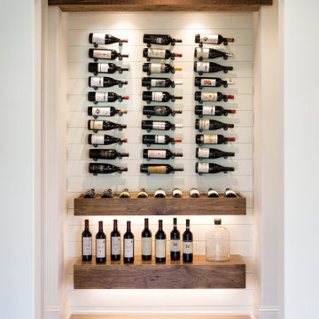 Weathered Antique Box Beam and Floating Shelves in a Wine Display Niche