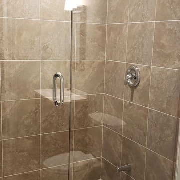 Wall-to-wall Enclosed Glass Shower.