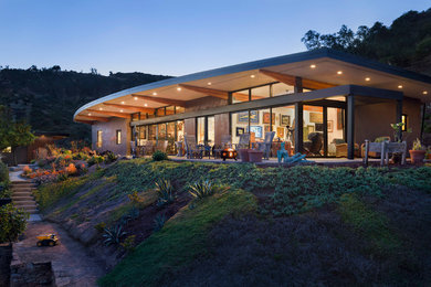 Contemporary one-story glass house exterior idea in Santa Barbara