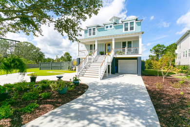 Photo of a mid-sized beach style three-storey blue house exterior in Charleston.