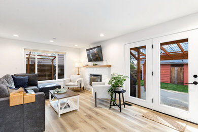 Living room - mid-sized transitional open concept living room idea in Seattle with a brick fireplace