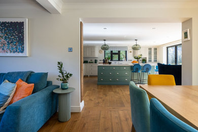 Photo of a large modern open plan kitchen in Kent with an island.