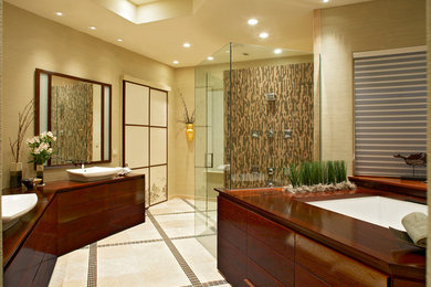 This is an example of a large asian master bathroom in Dallas with a curbless shower, travertine floors, wood benchtops, flat-panel cabinets, dark wood cabinets, a vessel sink, beige walls, an undermount tub, matchstick tile, beige floor and a hinged shower door.