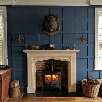 Bespoke limestone fireplace mantel in a traditional library