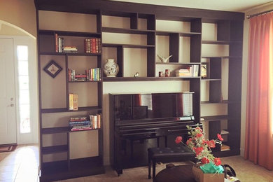 Mid-sized eclectic open concept family room library photo in Orlando with beige walls and no tv