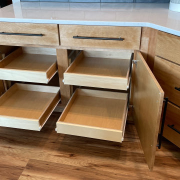 Angled Kitchen Design with Slab Style Cabinets in Pecan Stain