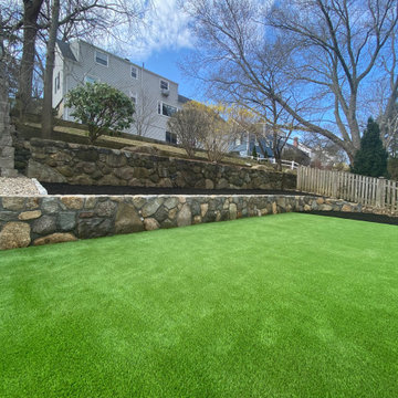 A stone wall was also placed up top to separate the neighbors yard.