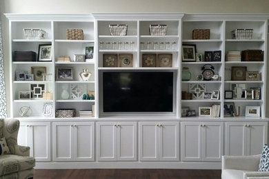 Living room - large contemporary open concept living room idea in Providence with beige walls and a media wall