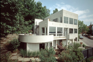 Contemporary white stucco exterior home idea in Cincinnati