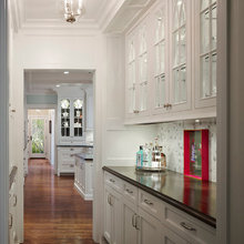 Cupboards to match kitchen across from dining room table