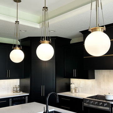Black and Maple Wheat Kitchen with Brass Banded Hood