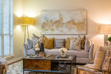 Inspiration for a mid-sized transitional formal and enclosed dark wood floor and brown floor living room remodel in Austin with beige walls and no tv