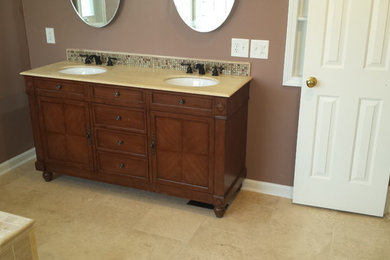 Design ideas for a large traditional master bathroom in Detroit with flat-panel cabinets, dark wood cabinets, granite benchtops, beige tile, cement tile, brown walls and ceramic floors.