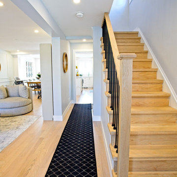 Long Entry Hall with White-Oak Stairs and Black Patterned Runner | The Junction
