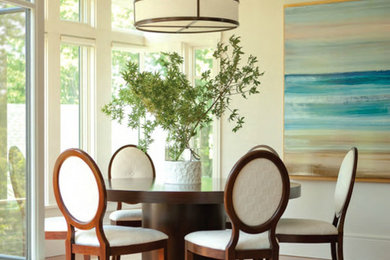 Photo of a mid-sized transitional dining room in Other with white walls and medium hardwood floors.