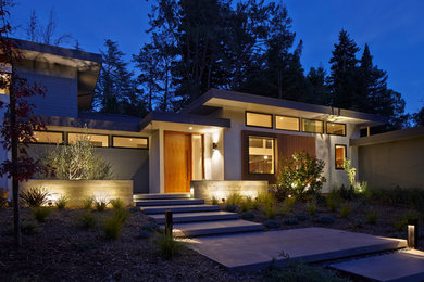 Inspiration for a large modern two-storey grey exterior in San Francisco with mixed siding and a flat roof.