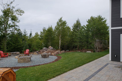 Inspiration for a large traditional full sun side yard concrete paver landscaping in Other.
