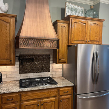 Perfect Design: Copper Range Hood with Wood Cabinets