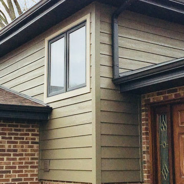 Diamond Kote siding, aluminum Dark bronze soffit and gutters