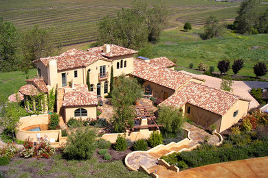 Inspiration for a large mediterranean full sun backyard stone landscaping in San Luis Obispo for spring.