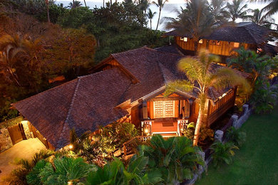 Example of an island style exterior home design in Hawaii