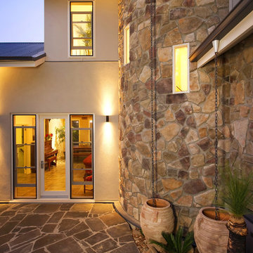 Traditional Exteriors Featuring Stone