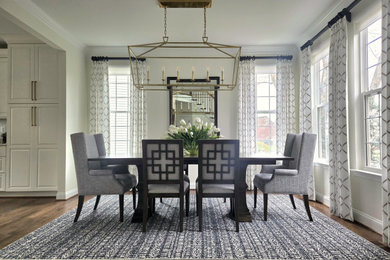 Inspiration for a mid-sized transitional dark wood floor enclosed dining room remodel in DC Metro with white walls