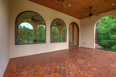 This is an example of a mediterranean porch design in Austin.