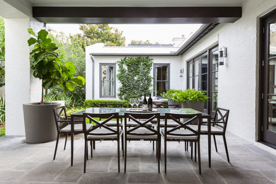 Example of a transitional patio design in Houston
