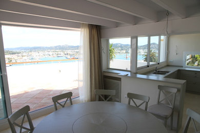 Example of a beach style dining room design in Milan