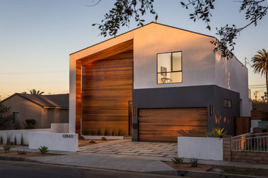 Example of a trendy multicolored two-story mixed siding exterior home design in Los Angeles